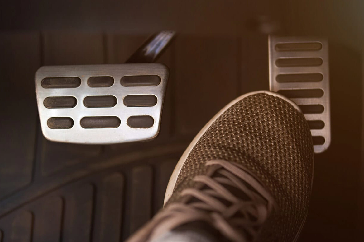 pressing the accelerator with your foot